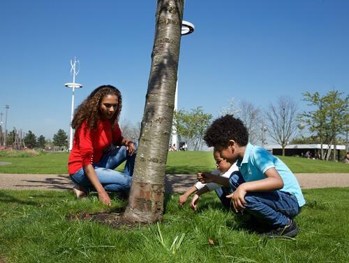 Mother and son playing in the grass