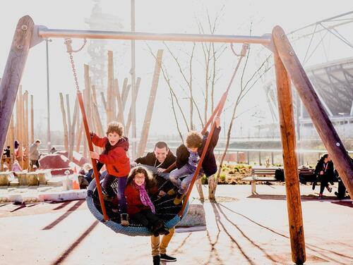 Kids smiling on swing