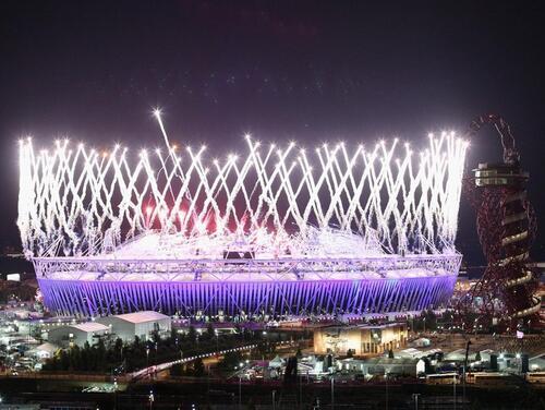 Fireworks at night around the Queen Elizabeth Olympic Stadium