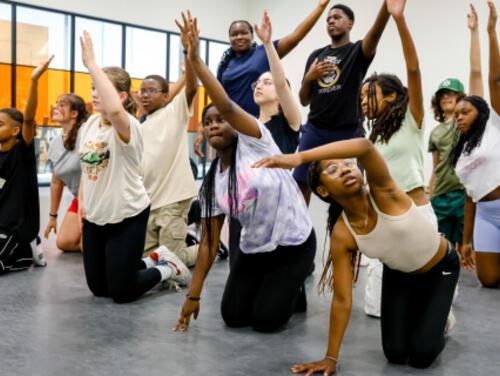 A group of teenagers dancing at East Summer School