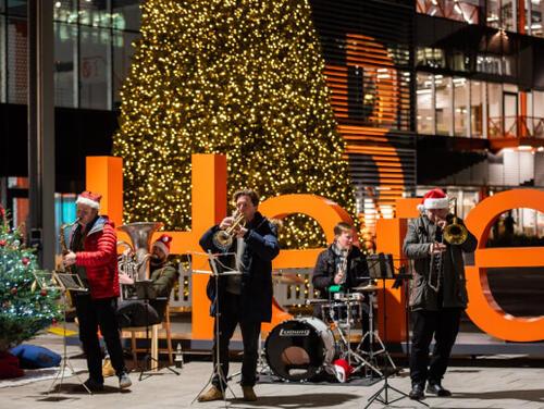 Brass band playing at Here East