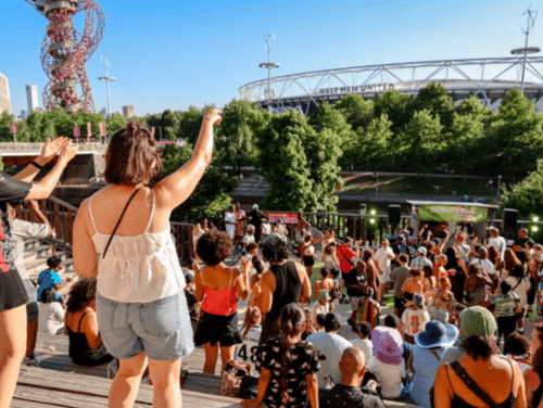 A crowd dancing to music overlooking London Stadium