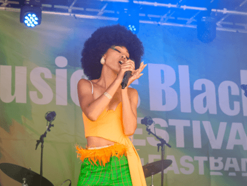 A young female singer performing on stage
