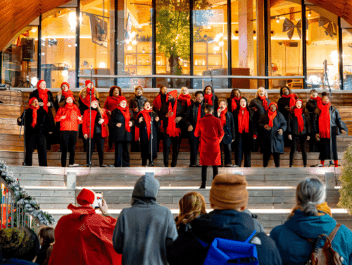 A choir singing in red