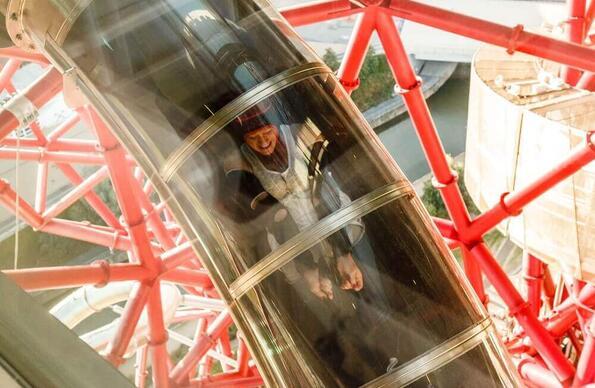 A Woman going down the slide at the ArcelorMittal Orbit  