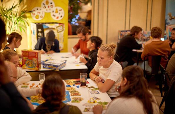 A photo of people playing board games at Draughts A photo of people playing board games at Draughts