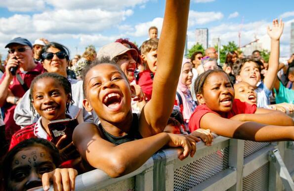 Children cheering on an act at the 2023 Great Get Together flagship community event. Children cheering on an act at the 2023 Great Get Together flagship community event.