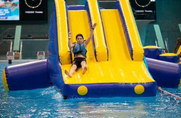 A child slides down a water slide at Aqua Splash at London Aquatics Centre