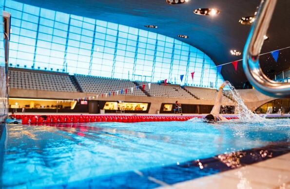A single swimmer at the London Aquatics Centre