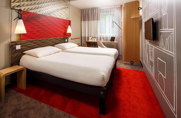 A twin room in The Ibis Stratford Hotel