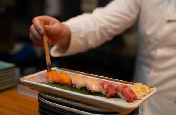 A chef preparing a seafood platter A chef preparing a seafood platter