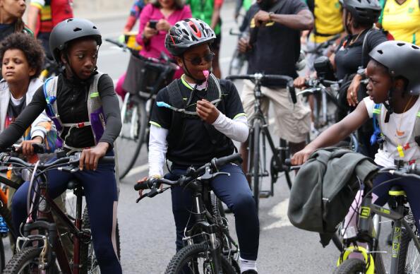 Children on bikes, taking part in Black Unity Bike Ride