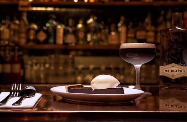 A cocktail and dessert A cocktail and dessert
