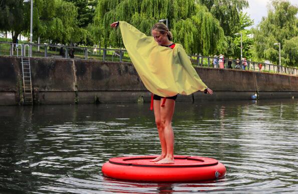 A participant of Discosailing floats down the river at Queen Elizabeth Olympic Park