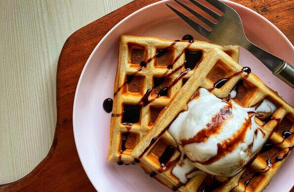 Two dessert waffles with ice cream. Two dessert waffles with ice cream.
