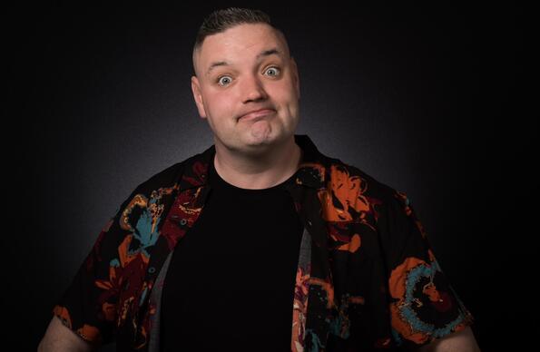 Comedian Graeme Mathews in a shirt with black background