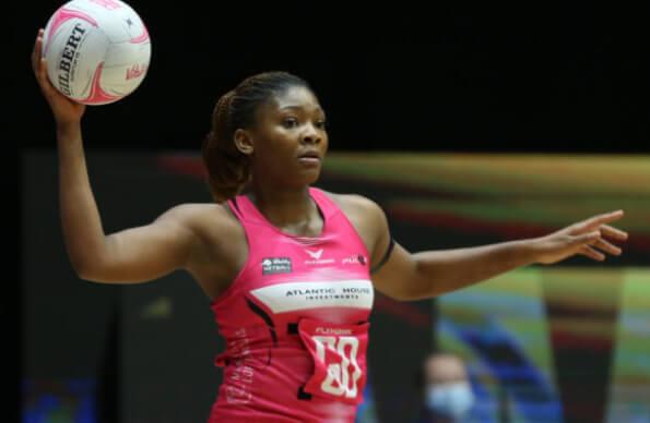 A London Pulse netball player readies to throw a ball