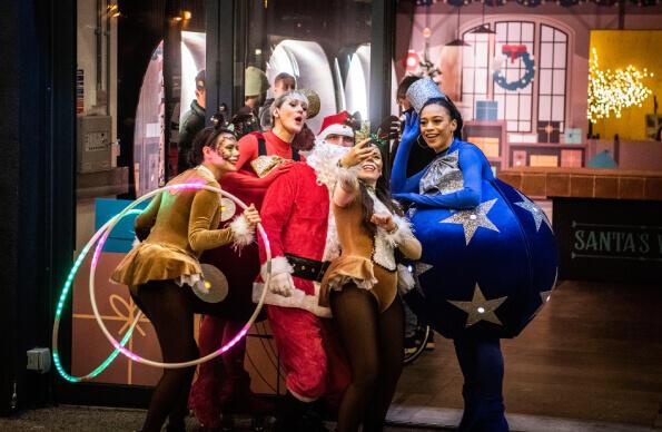 A group of people in festive costumes for Here East Merry Making