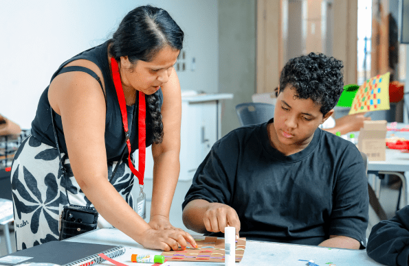 A student and teacher at East Summer School