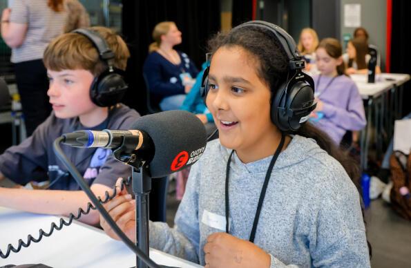 A student at a microphone
