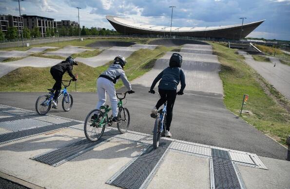 Three BMX cyclers at Lee Valley VeloPark