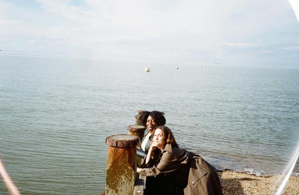 Yasmin Lacey and Tyson stood next to a body of water