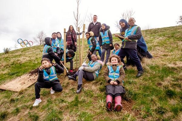 Children around planted tree