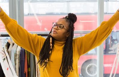 A person holds up a length of fabric
