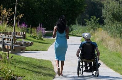 Wheelchair user going through London Blossom Garden