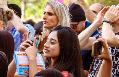 An audience watching a performance on the stage at Great Get Together on Queen Elizabeth Olympic Park