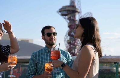 People drinking on Queen Elizabeth Olympic Park