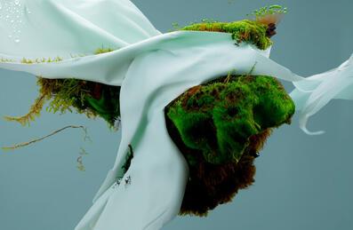 A textured design with grassy mound and silk covering