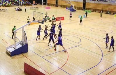Two teams play basketball as part of the London Youth Games