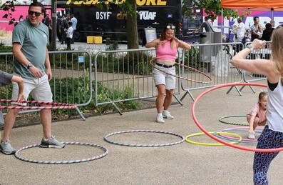 A family use hula-hoops at London Youth Games