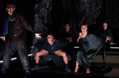 Dancers in a dark space