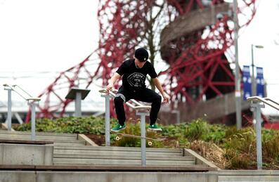 Skateboarder doing a trick by set of stairs
