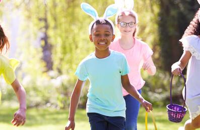Kids running holding easter egg baskets