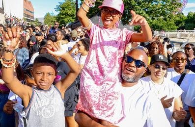 A family enjoys the music is black festival