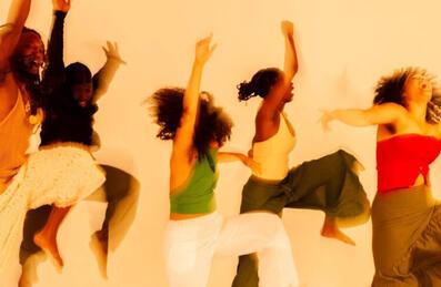 A group of people jump and dance © Solomon Charles-Kelly