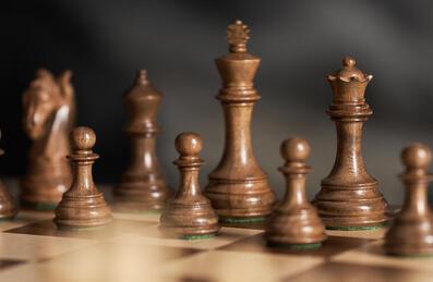 A chess board is set up for a new game