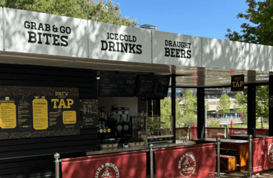 A F&B kiosk with terrace surrounded by leafy trees