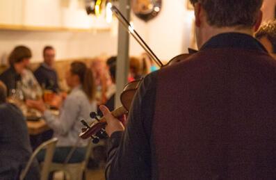 A band play in front of diners at Burns night at Barge East