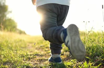 An image of a child running through a park