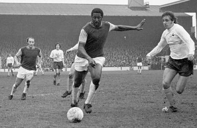 Clyde Best plays football in black and white