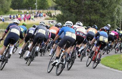A group of cyclists round a corner of the Road track at Lee Valley VeloPark