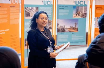 A UCL facilitator stands in front of students at East Careers Week