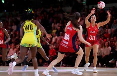 An England netball player passes the ball