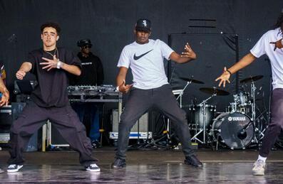 Dancers on stage at the Great Get Together