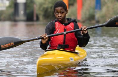 A young adult in a canoe 
