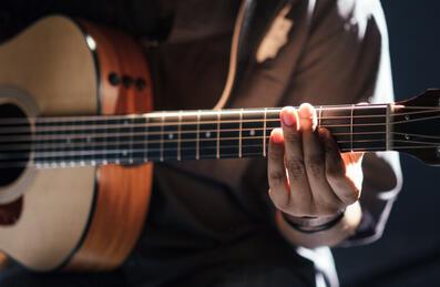 A person playing a guitar
